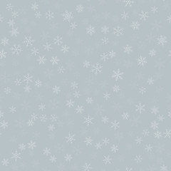 White snowflakes seamless pattern on light grey Christmas background. Chaotic scattered white snowflakes. Captivating Christmas creative pattern. Vector illustration.
