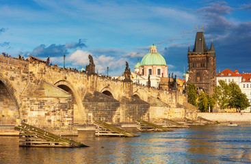 Fototapeta na wymiar Charles bridge with statues at the sunrise,Prague, Czech Republic