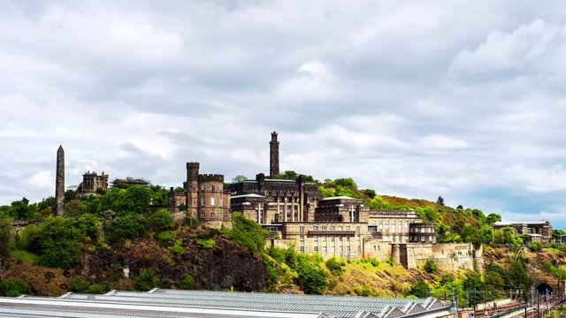 Edinburg, Scotland. Time-lapse of Calton Hill and its monuments in Edinburg, UK, on a sunny summer day with shadows of clouds moving along the buildings.