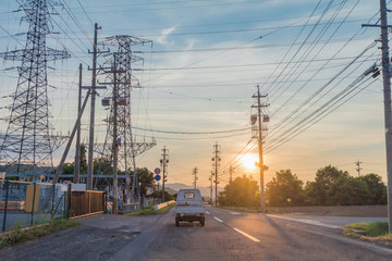  The road in the city and beautiful  sun rays  of sunset with colorful of  sky background  ,Nagano Prefecture, Japan.