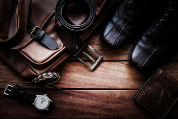 Men's leather accessories on rustic wooden background, fashion and beauty, travel concept