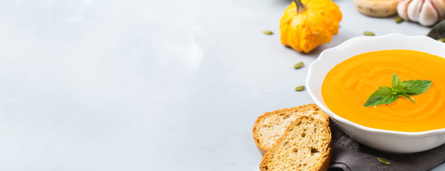 Fall autumn roasted orange pumpkin carrot soup with garlic