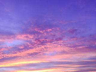 Naklejka na ściany i meble Beautiful sun rays of sunset with colorful of sky background .