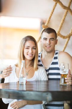 Beautiful young couple at a bar