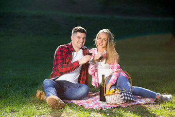 summer holidays, love, romance and people concept - happy smiling young couple outdoors