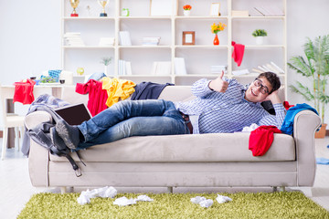 Young man working studying in messy room