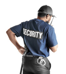 Male security guard using portable radio transmitter on white background