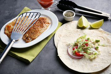 Ingredients for fish tacos on table