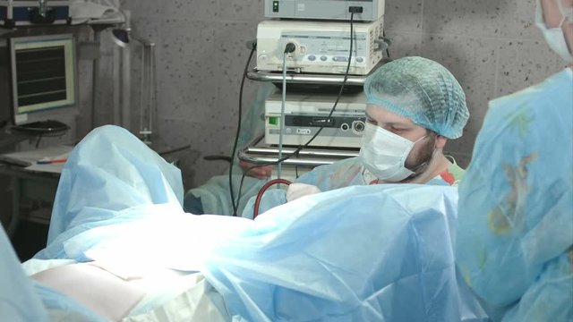 Medical team performing operation in hospital