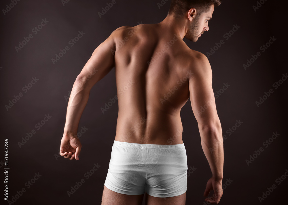 Sticker sporty young man on dark background