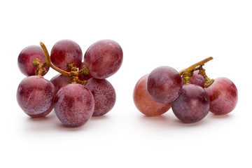 Ripe red grape isolated on white.