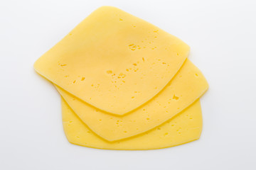 Cheese slices on the white background.