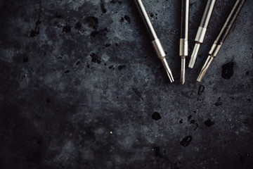 Repair screwdriver tools on the dark background. Close-up.