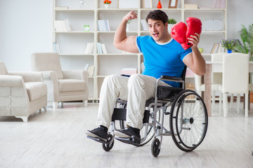 Disabled boxer at wheelchair recovering from injury