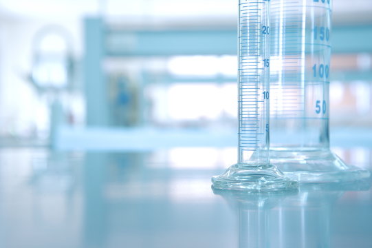 glass cylinder in research chemistry science laboratory background