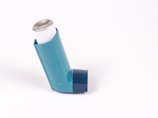 Asthma inhaler isolated on white.