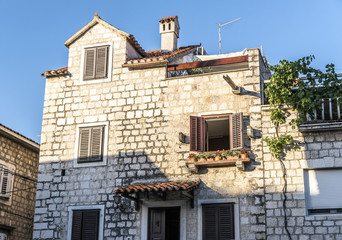 Fototapeta na wymiar Ancient buildings on the streets of Trogir in Croatia.