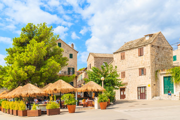 Obraz premium BOL PORT, CROATIA - SEP 8, 2017: Typical architecture of Bol town with stone houses, Brac island, Croatia.