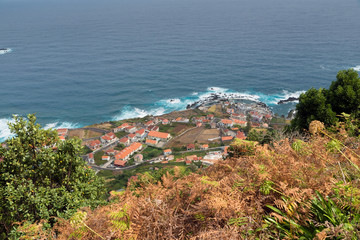 Top view of the village of Porto Moniz with lava-rock pool, Madeira Island, Portugal