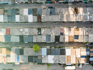 Dilapidated old shack looking one story buildings sitting in shade, depressed area, poverty, topview