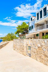 Apartments on coastal path along sea in Primosten old town, Dalmatia, Croatia