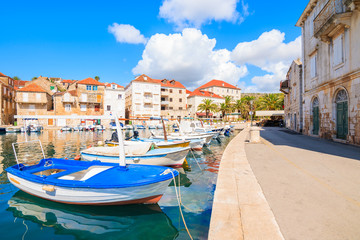 Fototapeta na wymiar Fishing boats in Milna port on beautiful sunny summer day, Brac island, Croatia