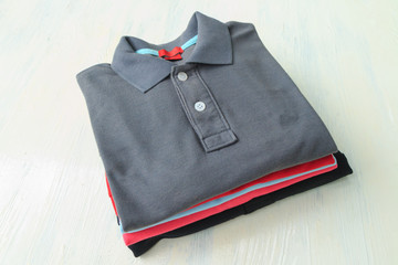 polo shirts on wooden
