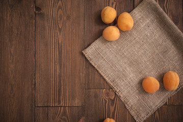 Delicious ripe apricots on a wooden background. Horizontal top view