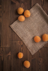 Delicious ripe apricots on a wooden background. Horizontal top view