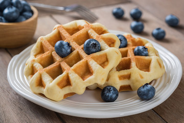 Waffle with blueberry on plate
