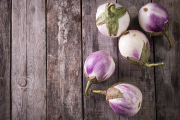 Healthy and delicious white eggplants on vintage background