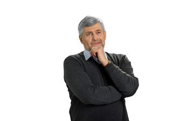 Thoughtful mature man, white background. Handsome grey hair man hold chin on hand looking into the distance.