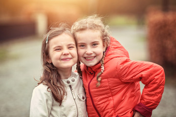 Friendly embrace of young girls