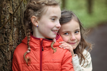 Young friends in the colorful autumn day have fun