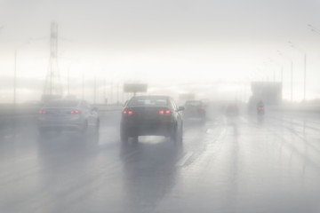 Drive car in rain on asphalt wet road. Clouds and sun.
