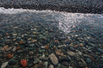 pebbles on the seabed transparent water