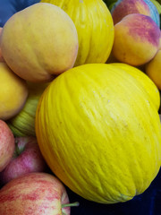 Melons and peaches in the market