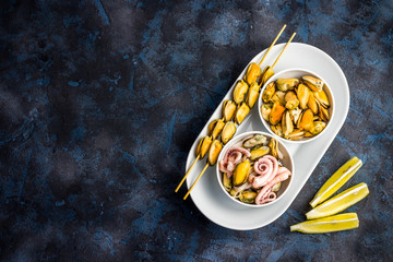 Seafood mix-mussels, calamari, octopus. Top view, copy space.