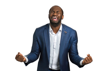Desperate businessman with problems shouting. Frustrated screaming black manager with mouth wide...