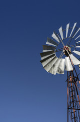 Pinwheel / Old windmill, alternative energy generation by wind energy.