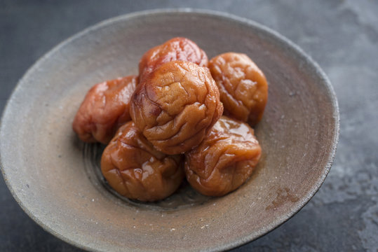 Traditional Japanese umeboshi as close-up in a bowl