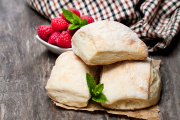 Homemade  fresh sourdough buns with on rustic wooden table