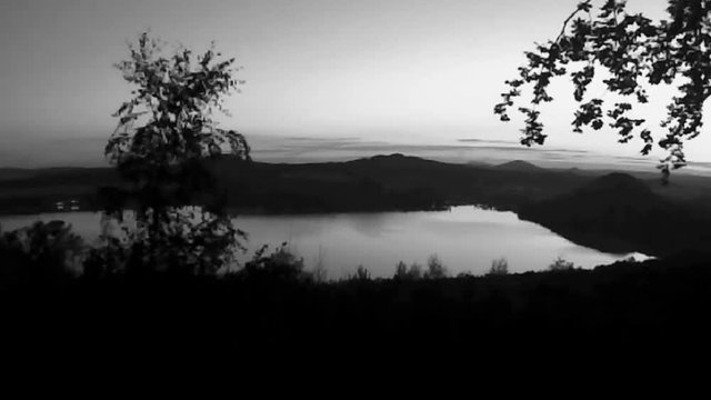 Machovo jezero lake seen from Borny hill forest in Macha's land during summer holidays in czech republic after sunset