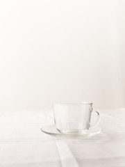 Empty transparent glass Cup with tea on white