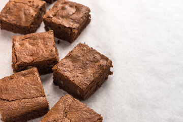 homemade chocolate brownies on white background.
