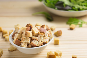homemade croutons in white ceramic bowl
