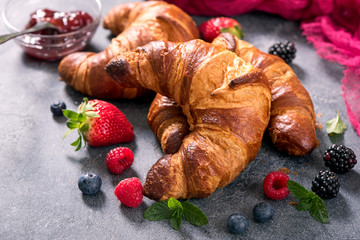 Fresh croissants with berries, delicious breakfast, bakery concept