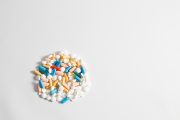 Pile of pills isolated on white background