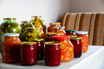 Homemade cans stand on table in room