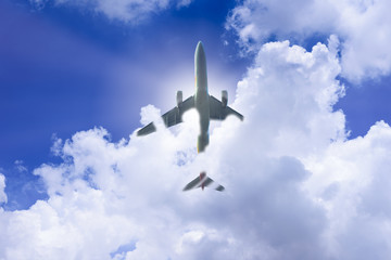 Airplane has takeoff in the blue sky background and white big cloud at sunrise in the morning on vacation and relax time. Travel, Journey, Vacation and Recreation concept.